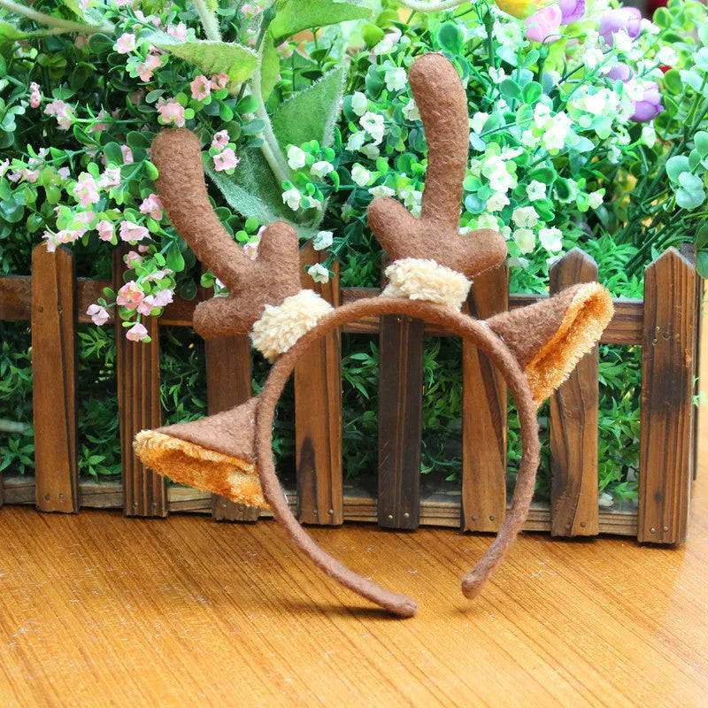 Five Christmas head buckles in different styles including hat, top hat, giraffe, deer, and antlers, made of plastic and flannel