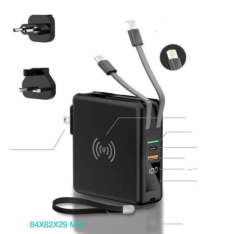 Black Super QI power bank with folding AC plug unfolded, showing wireless charging surface on top.