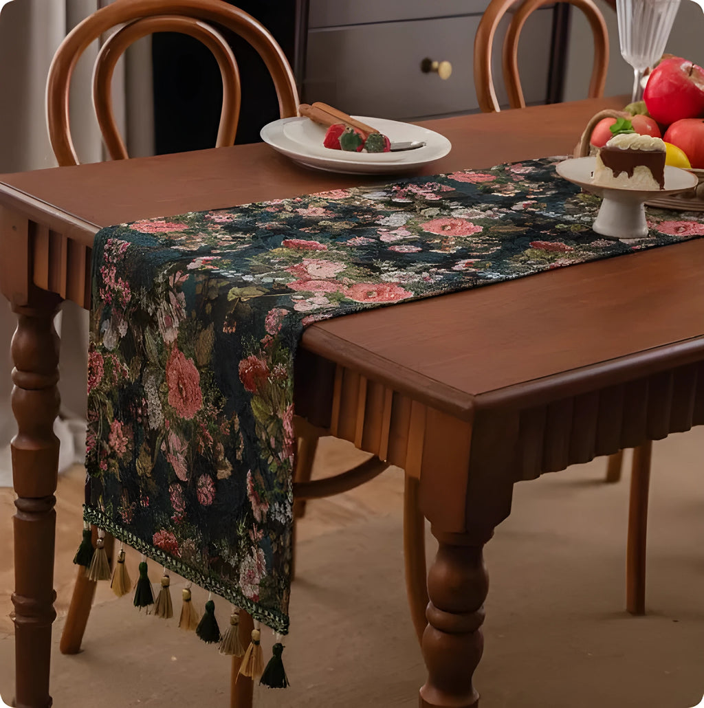 Country European retro style table flag with handwoven tassels in blue ginkgo leaf pattern lying on a wooden table.