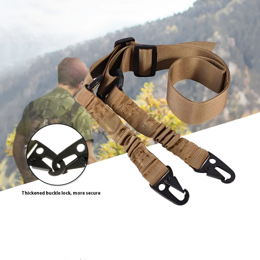 Black crossbody nylon survival tool placement rope with metal buckle and elastic tension adjustment on plain background
