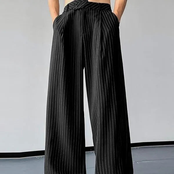Black men's casual trousers with vertical stripes and front pleats on a hanger.