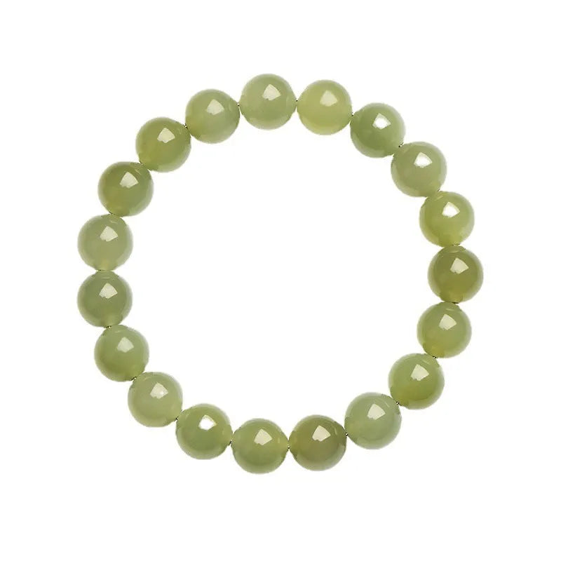 Polished Hetian jade bead bracelet in light or deep clear water colour on a wrist.