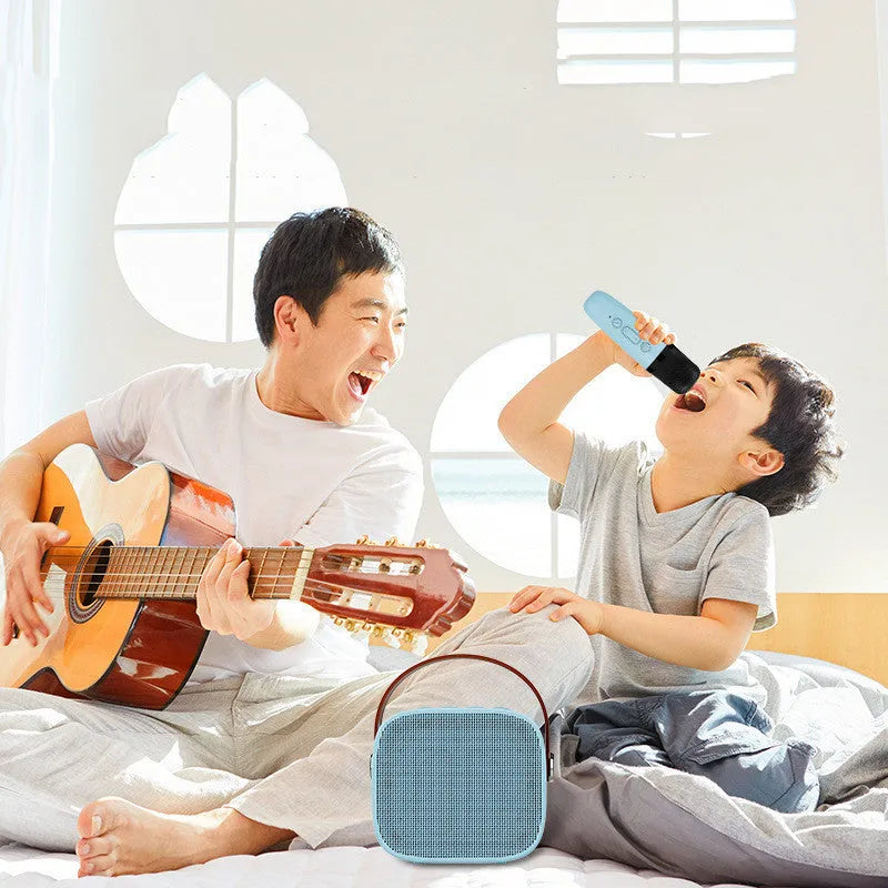 Compact white, pink, or blue wireless Bluetooth portable speaker with built-in microphone
