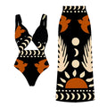 Women's black one-piece polyester swimsuit on a hanger, showing one-shoulder style