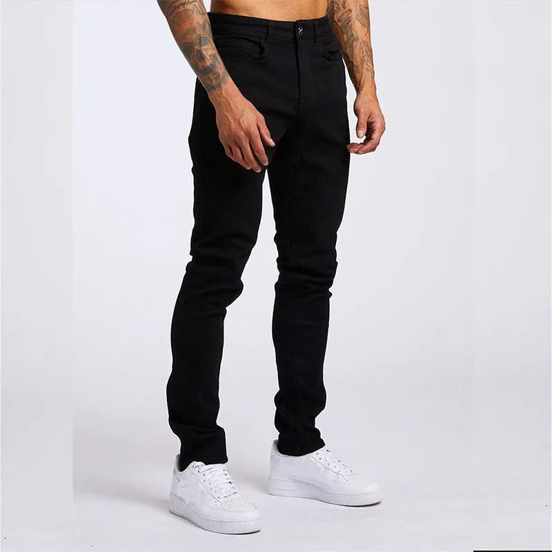Men's slim fit high waist cotton jeans in light blue or black, sizes 28 to 36