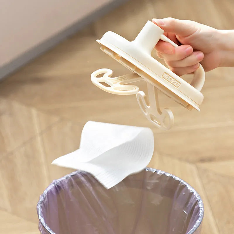 Magic Brush cleaning tool with disposable white rag heads for bathroom tile and glass cleaning.