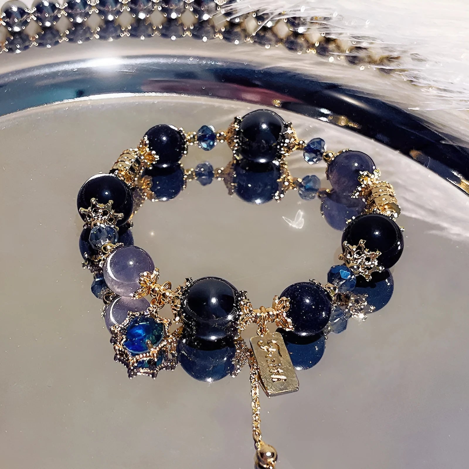 Galaxy-coloured women's bracelet with snowflake pendant, bow, and heart designs