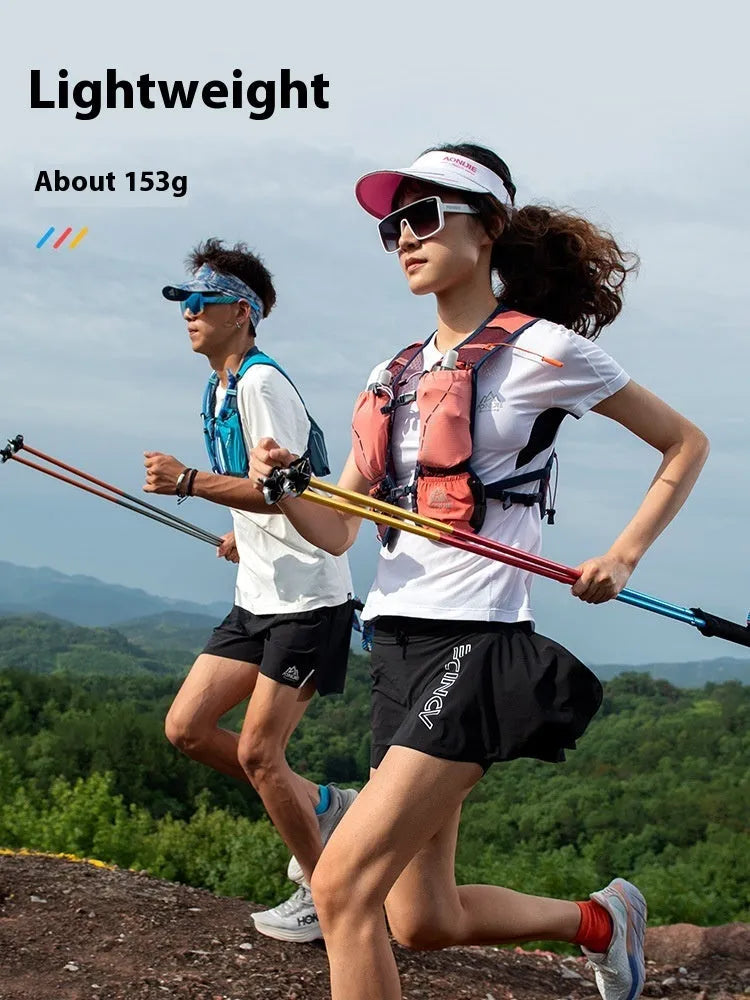 Pair of carbon fibre folding trekking poles with tungsten steel tips in colourful finish for hiking