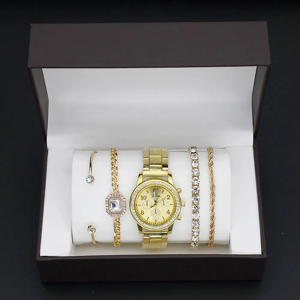 Women's 4 piece watch and bracelet set in gold colour with quartz movement and 34mm dial on display