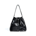 Genuine leather retro one-shoulder bucket bag in burgundy showing interior zipper and file pockets
