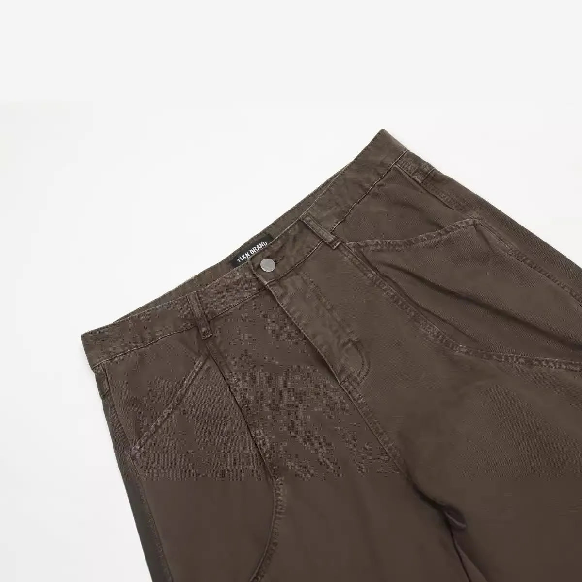 Men's brown loose straight leg cotton trousers with high waist and zipper fly