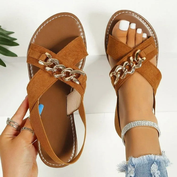 Chains sandals in black with elasticated open toe slide design, rubber sole, and metal detail on PU upper