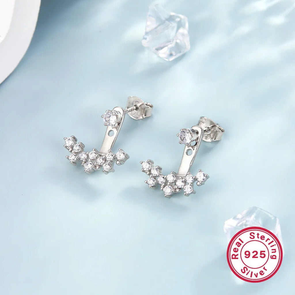 925 silver smile earrings with French diamond-embedded continuous stone setting, geometric U-shape, on a light background
