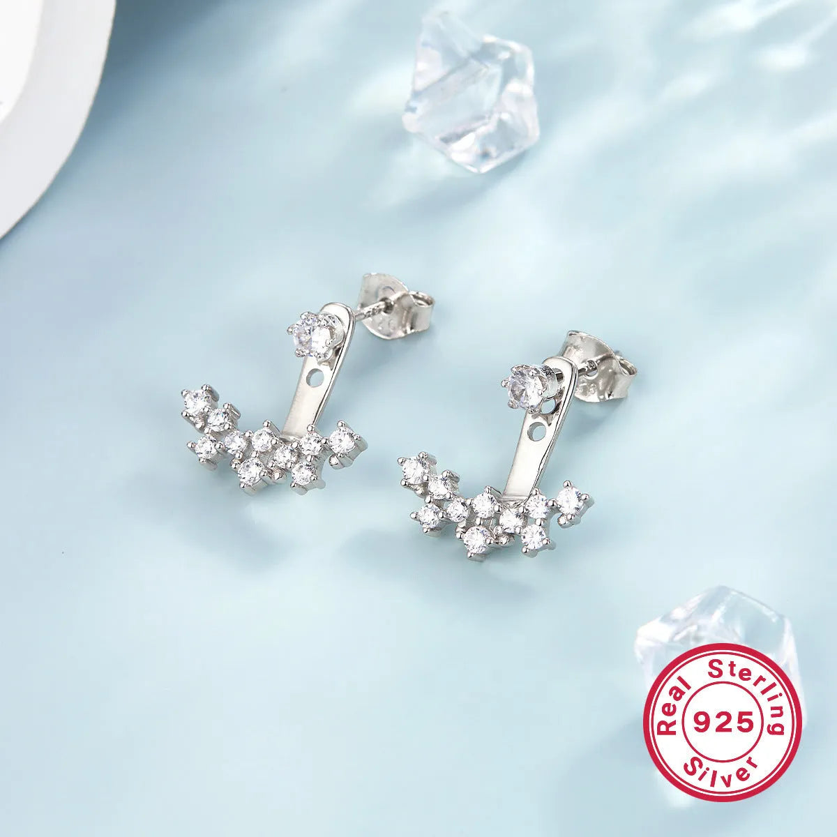 925 silver smile earrings with French diamond-embedded continuous stone setting, geometric U-shape, on a light background