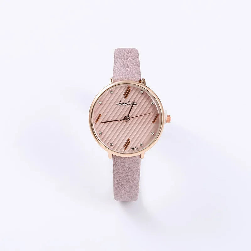 Trendy student watch with round white dial, 32mm diameter, stainless steel buckle on a light background