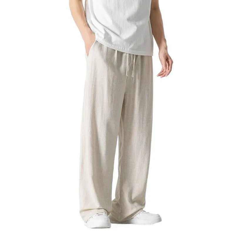Men's beige linen-blend cropped trousers with a drawstring waist on a plain background.
