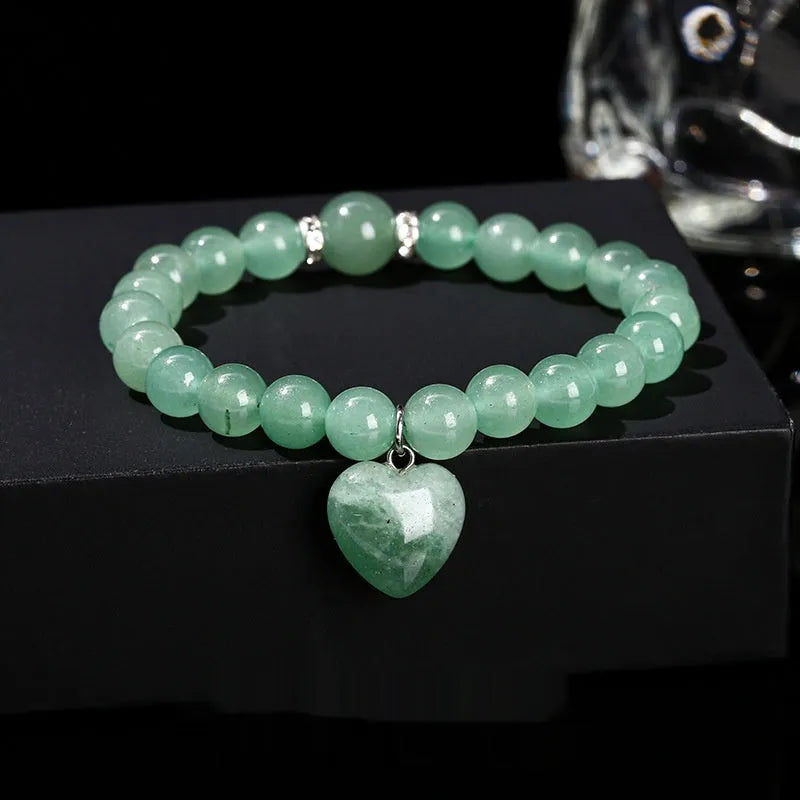 Natural stone bracelet with geometric love pendant in tigereye, crystal, aventurine, jade, and unakite stones