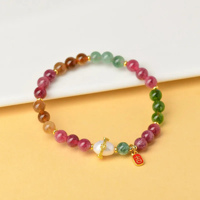 Geometric chalcedony bead bracelet with adjustable string closure in tourmaline colour