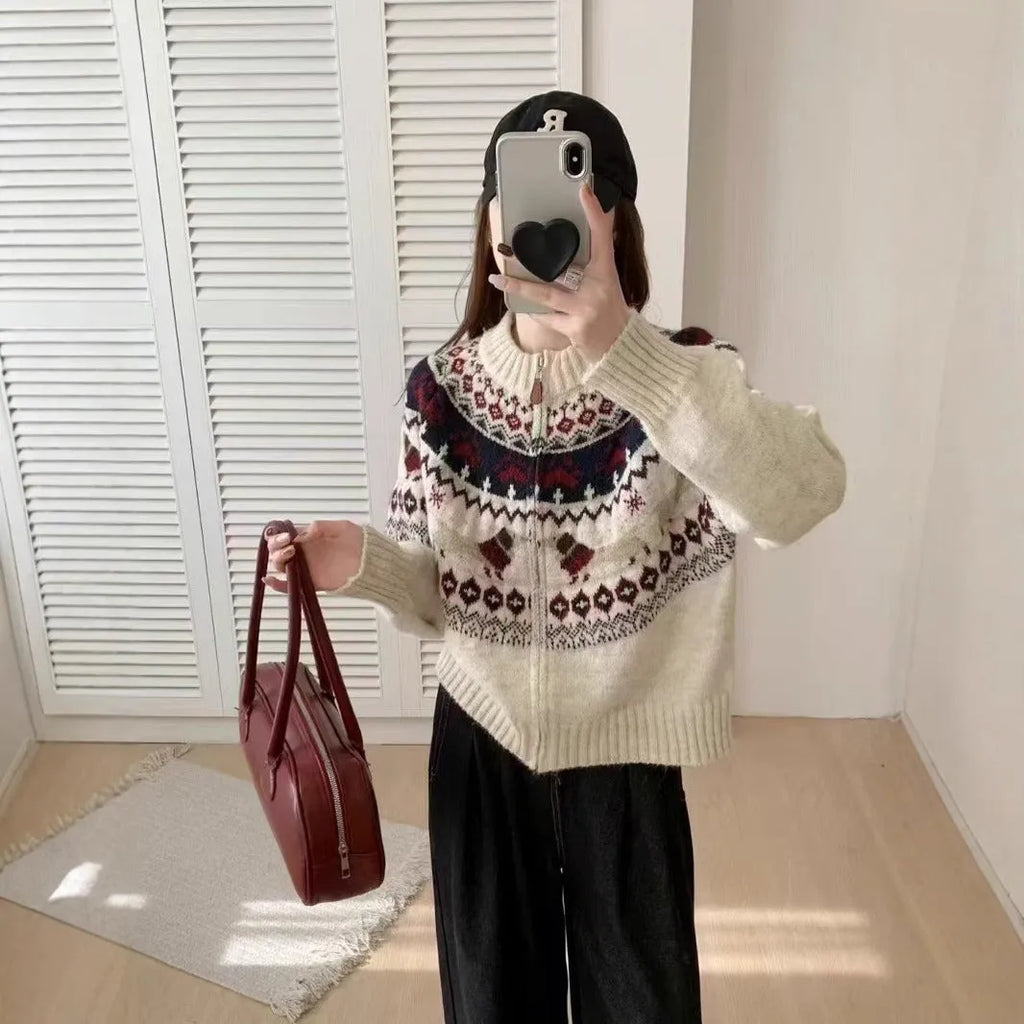 Ethnic patterned heavy industry jacquard pullover sweater in apricot colour, showing 3D texture and loose fit.