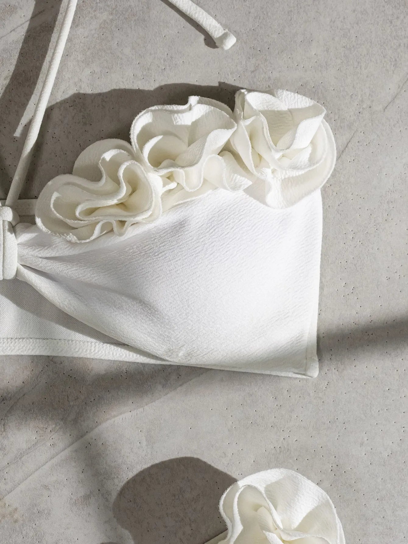 White halter neck lace-up swimsuit with three-dimensional floral pattern and split briefs style