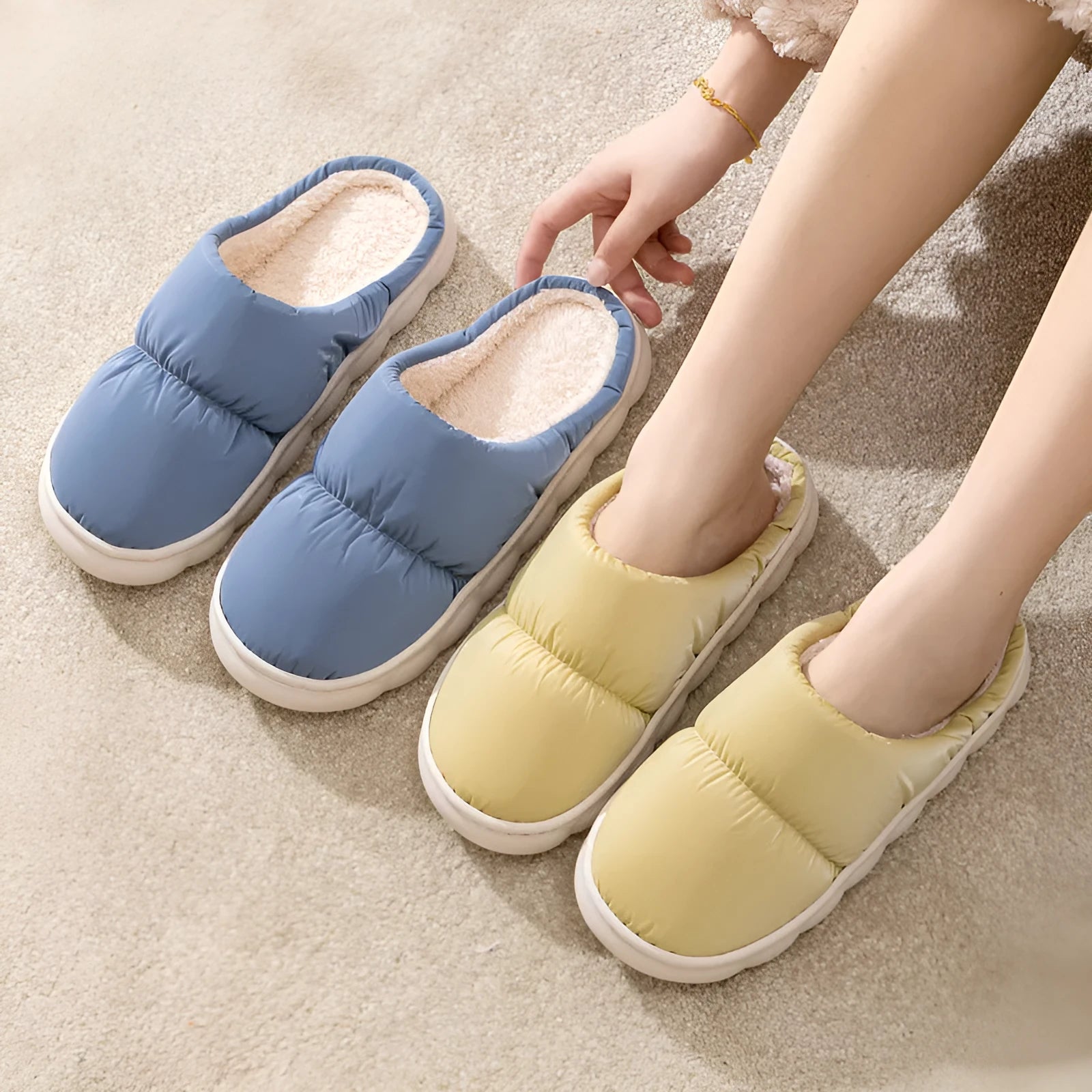 A pair of down cotton indoor slippers with a thick rubber sole and plush lining, shown in a choice of colours.
