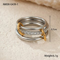 Stacked colour matching stainless steel ring with 18K gold plating on a hand.
