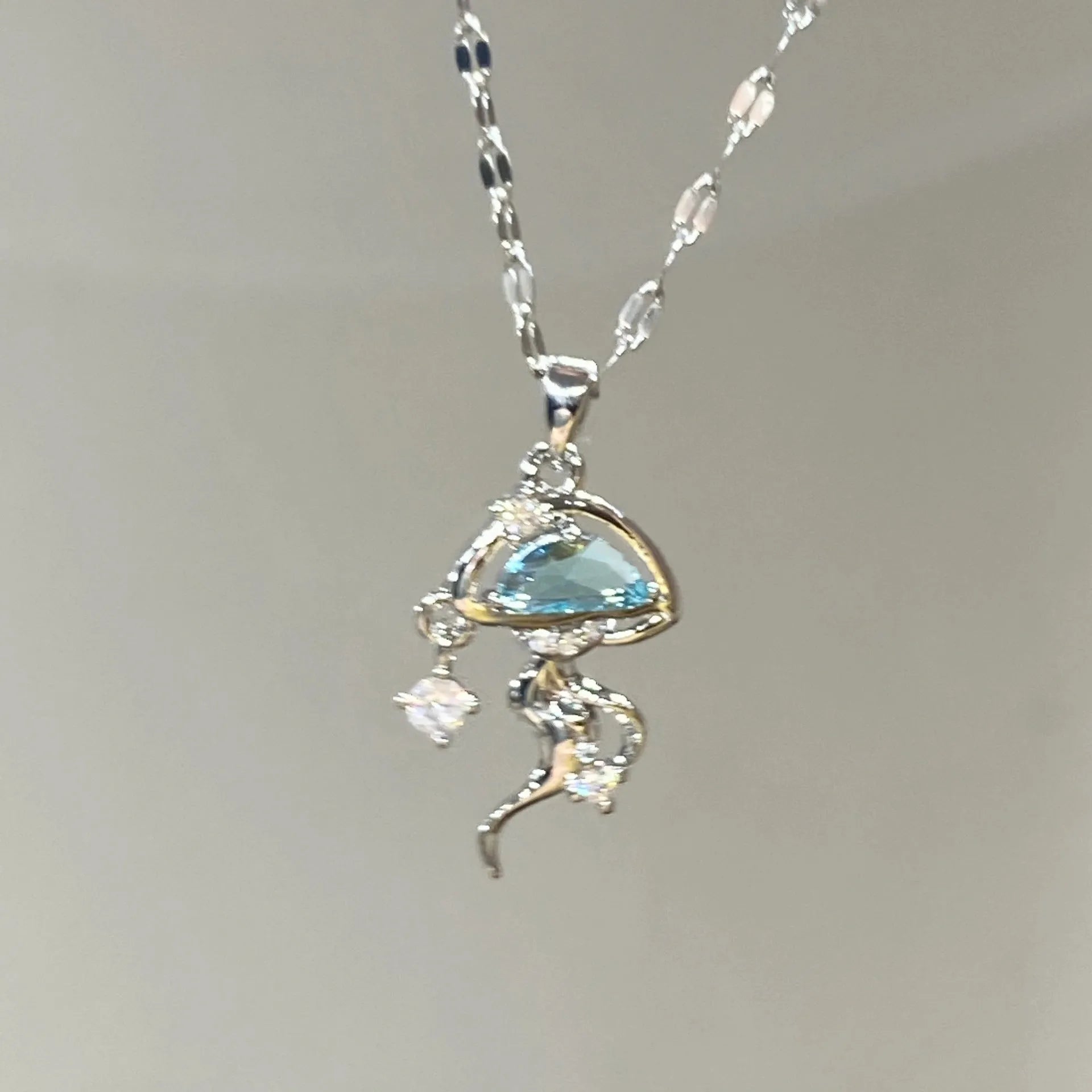 S925 sterling silver blue jellyfish necklace with adjustable chain on white background