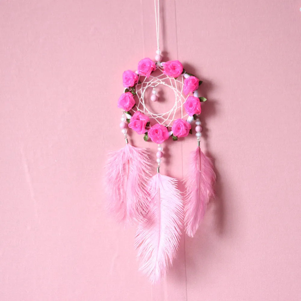 Pink ostrich feather dreamcatcher wall decoration ornament measuring 10cm.