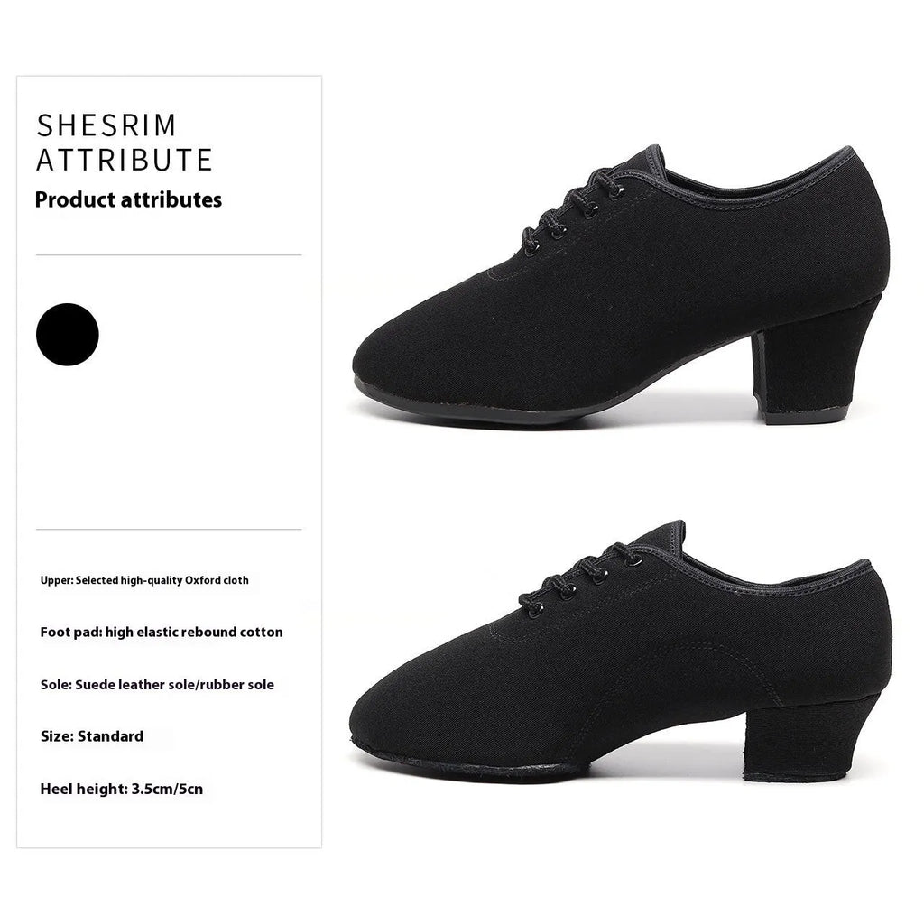 Men's black oxford cloth ballroom dancing shoes with rubber sole and middle heel on a dance floor