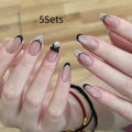 Colourful children's fake nails with pink, blue, purple, and rainbow designs for dress-up play