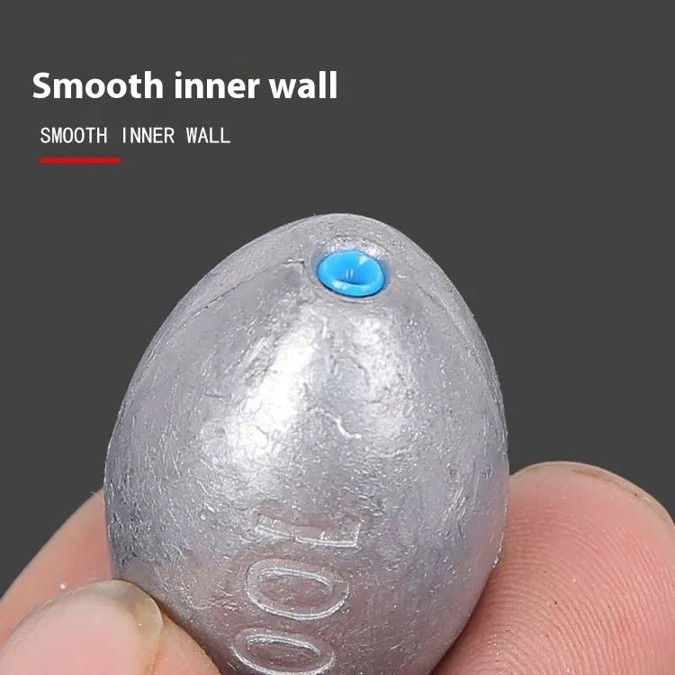 Tongxin scale olive lead fishing sinker with rugby shape and plastic core, shown in various weights.