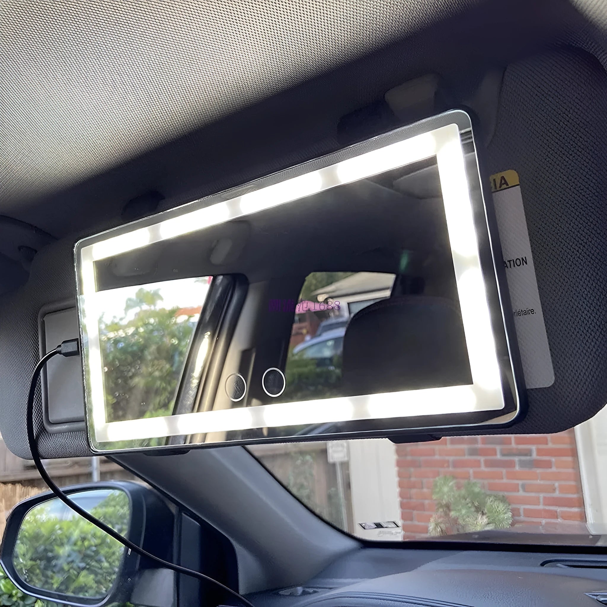 Car sun louver mirror with LED touch lamp clipped to sun visor, showing aluminium mirror and black light bars on four sides