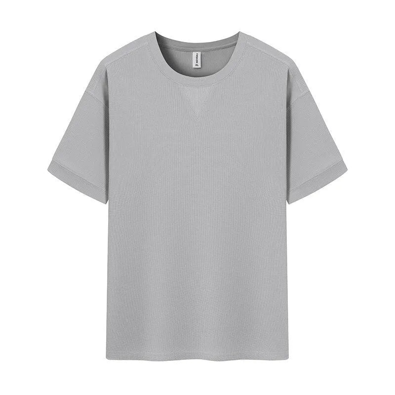 Men's heavyweight waffle-knit short-sleeve t-shirt in a solid colour on a size chart background.