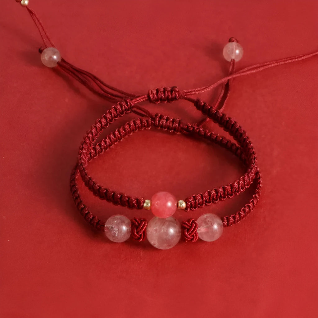 Woven red rope bracelet with strawberry quartz sphere beads and alloy detailing