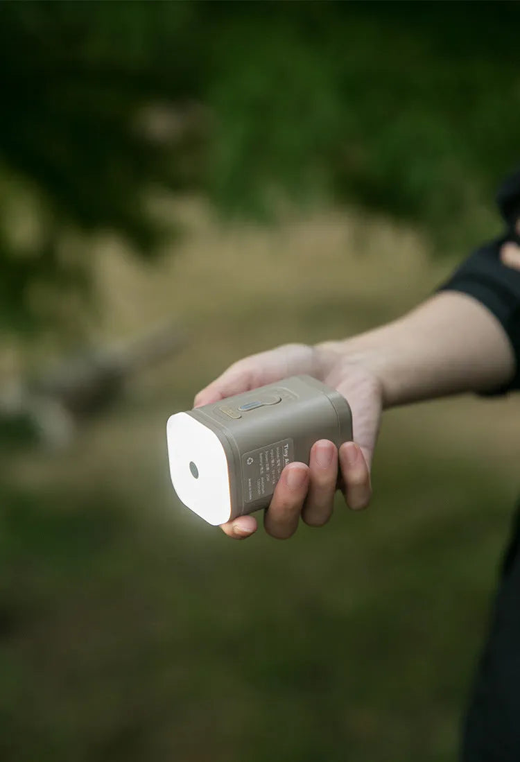 Mini electric air pump for camping mats in khaki, black, light bean green, or gray colour options
