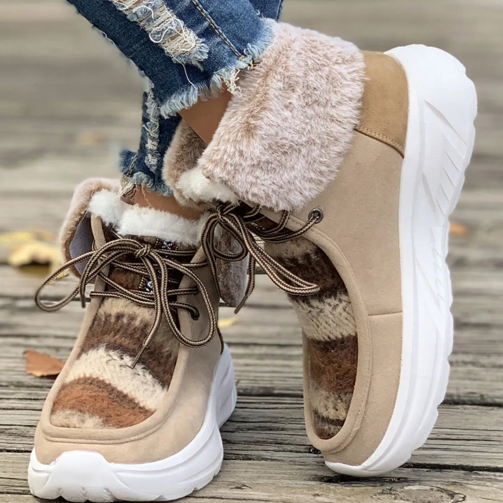 Beige women's lace-up mid-top snow boots with a fuzzy lining and thick platform sole.