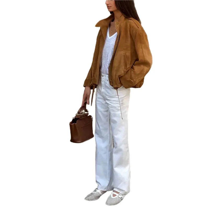 Retro solid colour loose-fit polyester jacket with long sleeves on a hanger.
