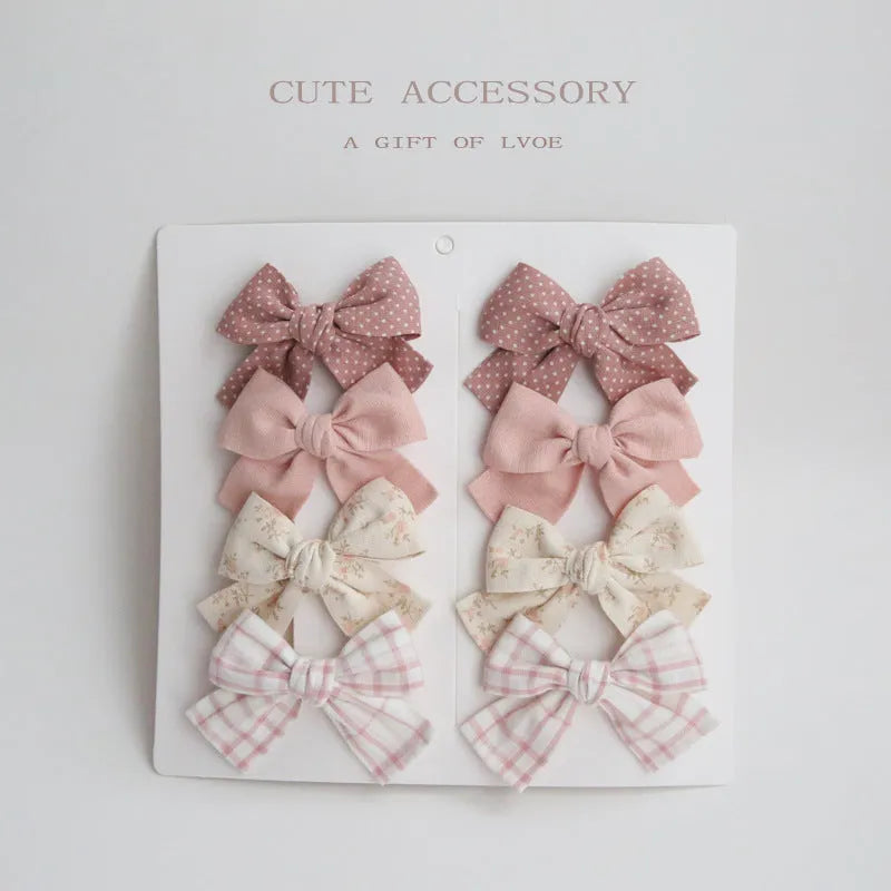 Children's cloth hairclips with dovetail bow design in multiple colour sets including beige brown grid dots