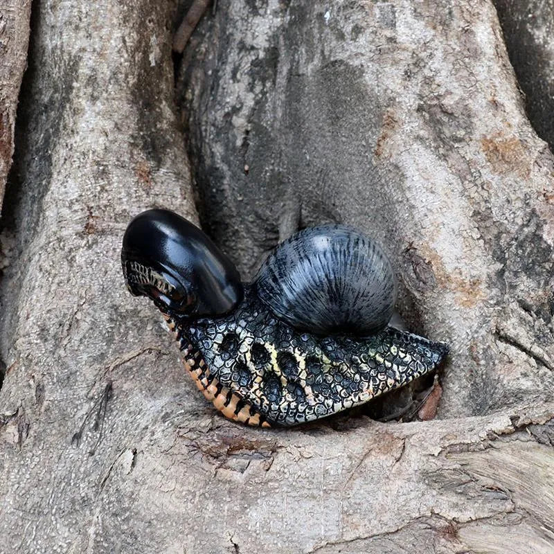 Resin garden snail sculpture with character design and coloured finish
