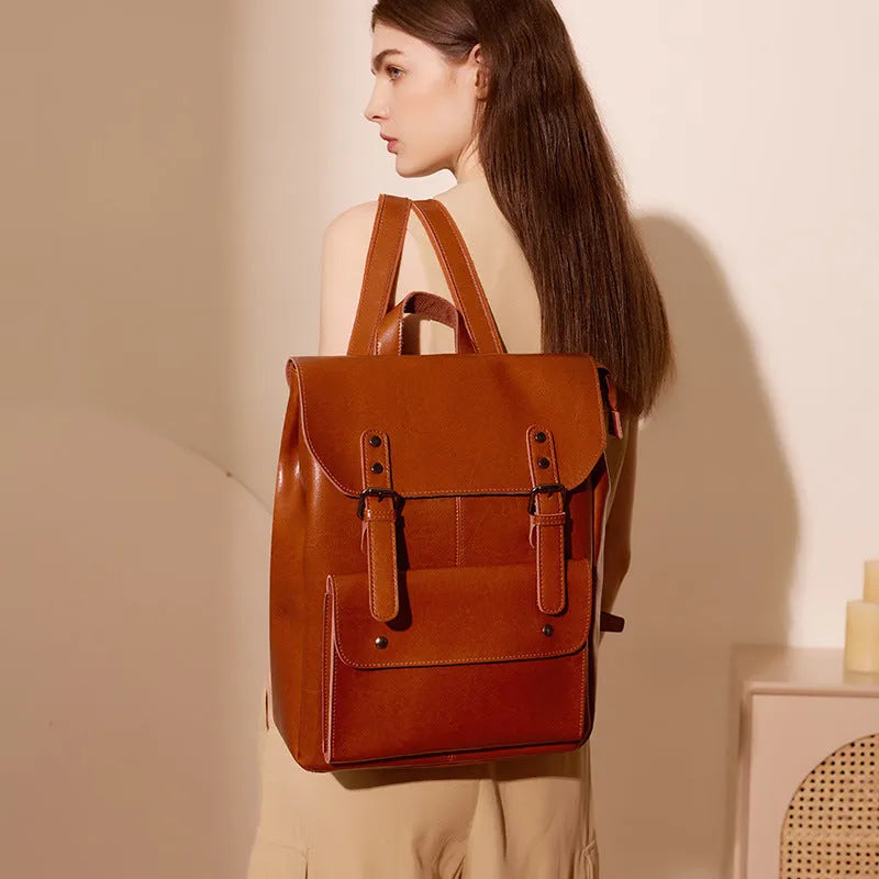 Black cowhide leather laptop backpack for women with a structured, hard-sided design.
