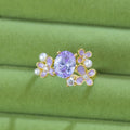 Women's flower pearl zircon open ring showing adjustable opening and electroplated metal construction