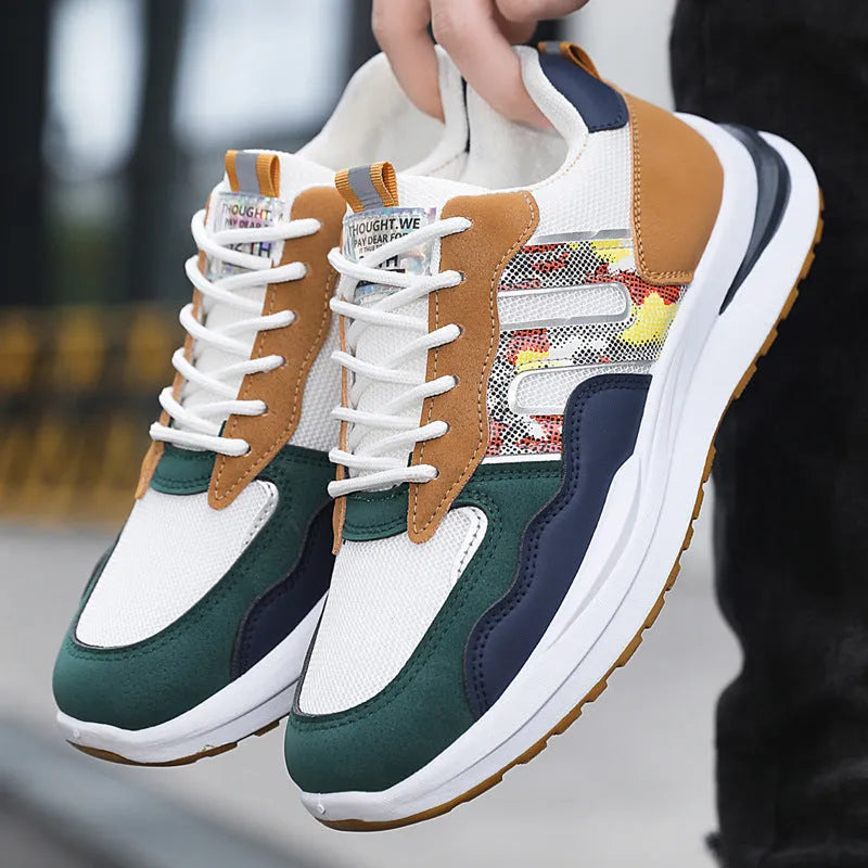 Men's white green mesh sports casual shoe with leather toe holder on a plain background.