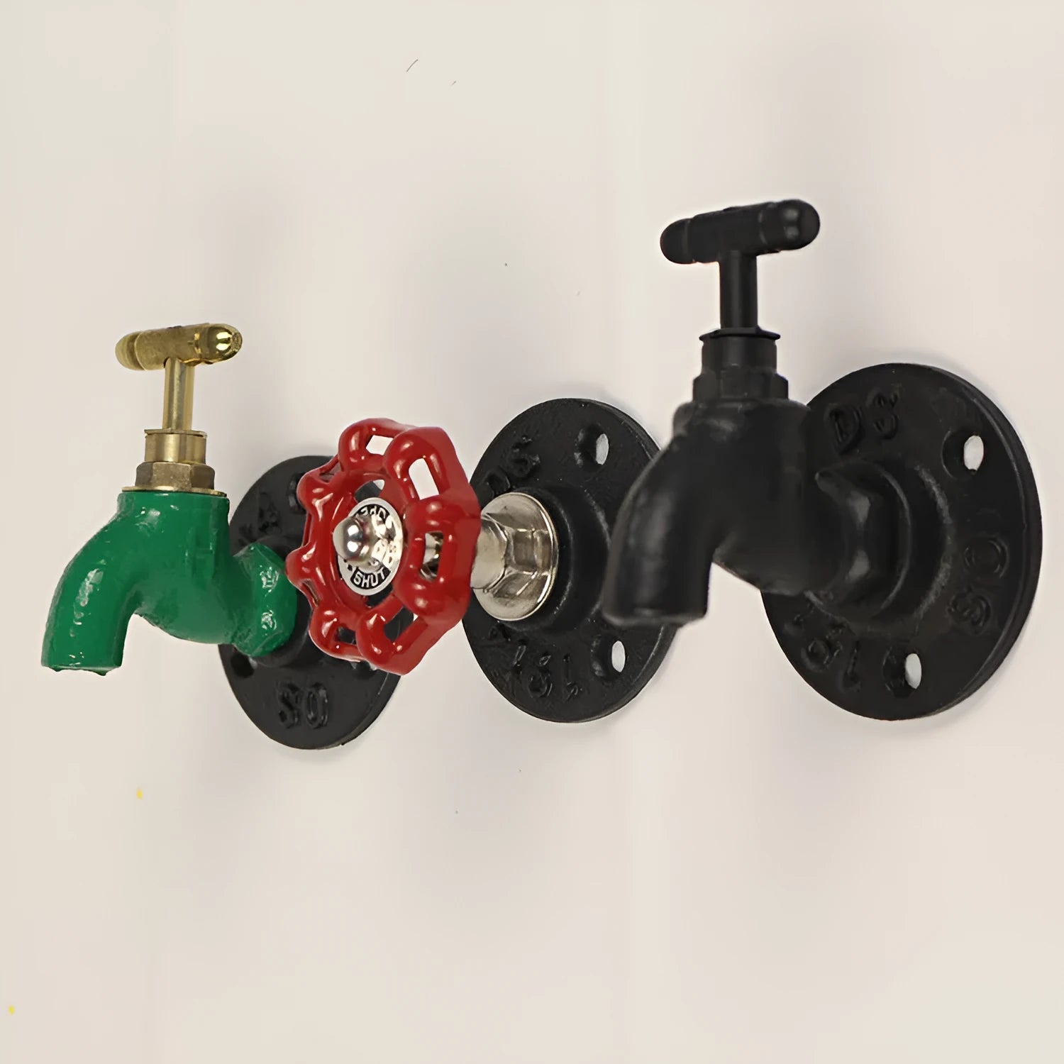 Metal water pipe style wall hanging hook in a choice of colours on a white wall.