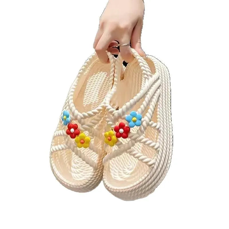 Women's PVC sandals with floral decorations and round toe design in beige colour