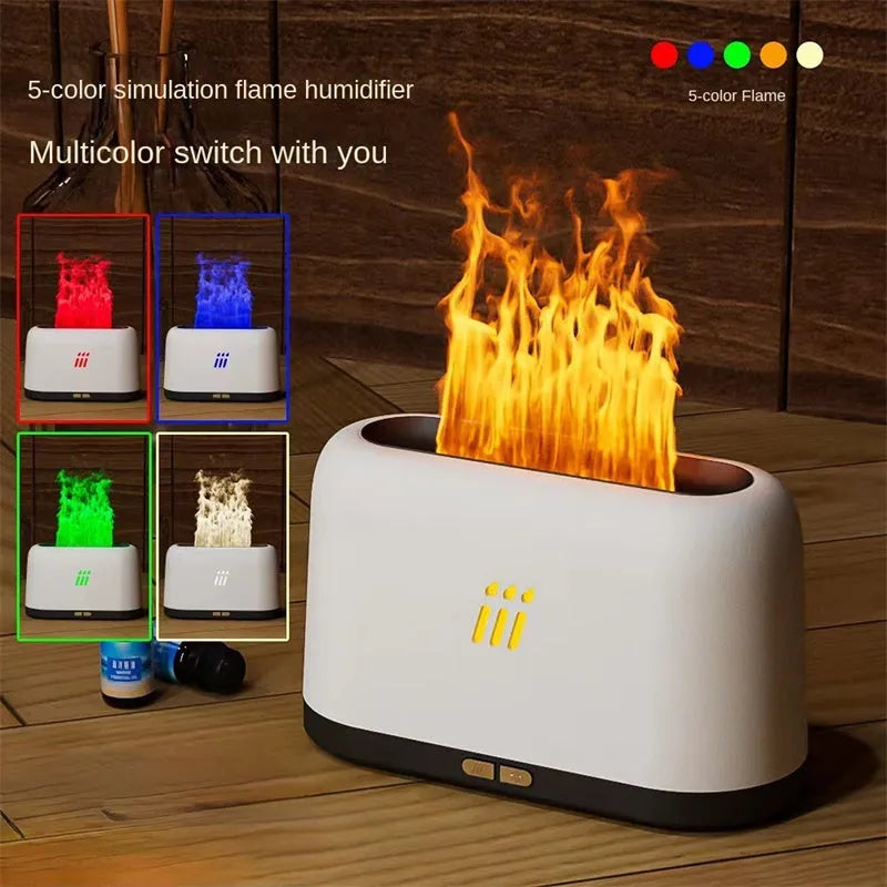 Black round flame aroma diffuser and humidifier with LED lights on a table.