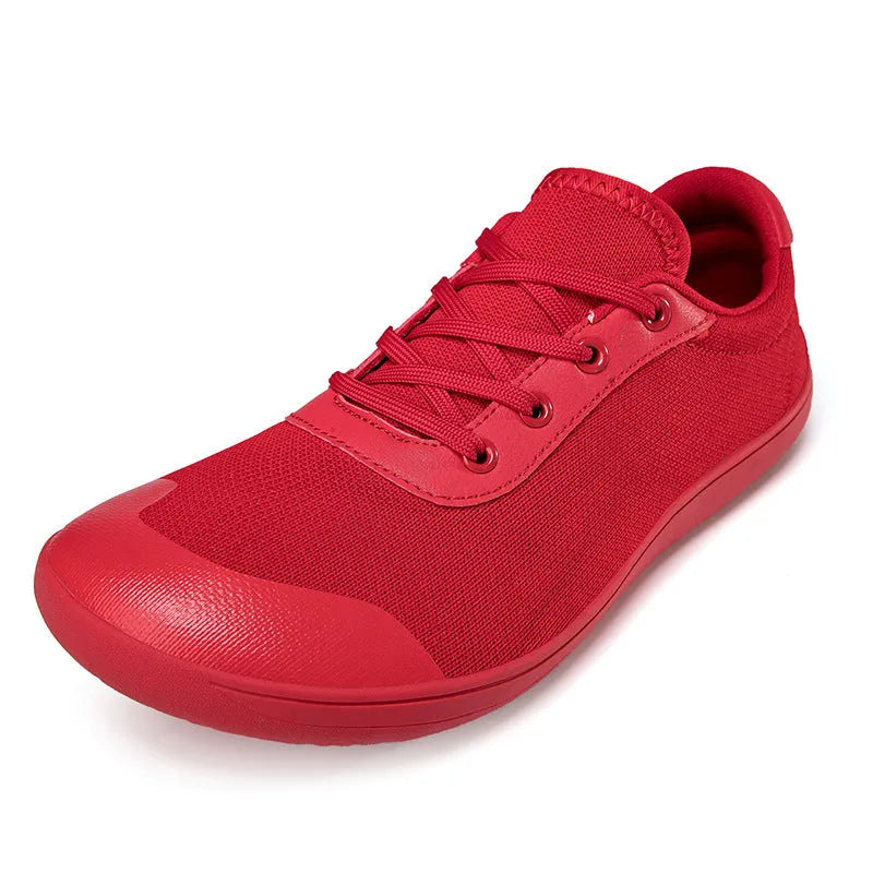 Men's low-top training shoe in a solid colour with a mesh upper and ribbed outsole, shown in a larger size.
