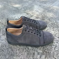 Men's grey colour-block casual sneakers with lace-up front and rubber sole on a white background