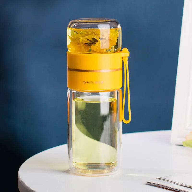 Glass water bottle with tea infuser filter showing double wall construction and portable rope