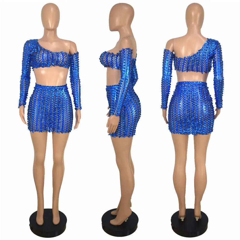 Women's sleeveless hollow-out two-piece dress set in polyester, showing top and short skirt with net hole detail.