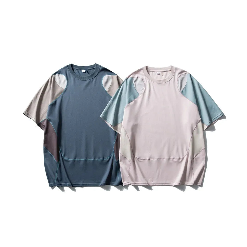 Men's loose fit patchwork t-shirt in blue or beige with short raglan sleeves.